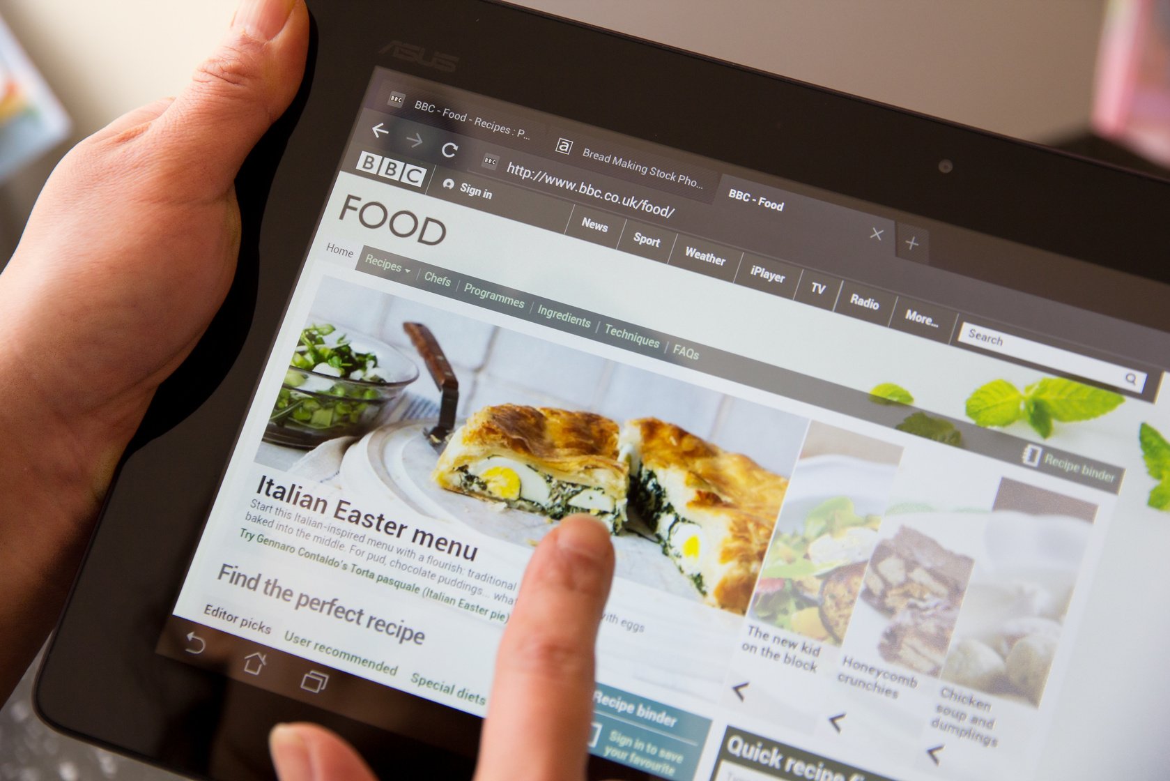 Woman browsing BBC food website on a tablet computer